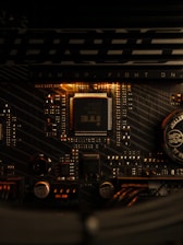 A close up of a computer motherboard with a clock