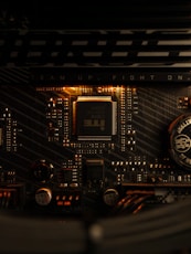 A close up of a computer motherboard with a clock
