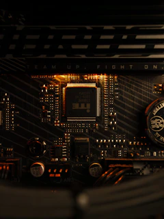 A close up of a computer motherboard with a clock