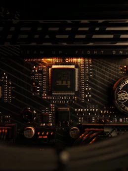 A close up of a computer motherboard with a clock