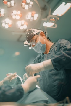 A surgeon is performing surgery on a patient