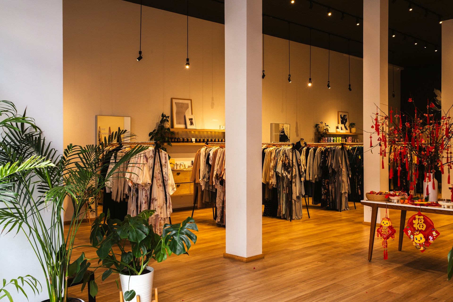 A clothing store with a lot of clothes on display