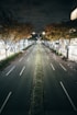 An empty street at night with no cars on it
