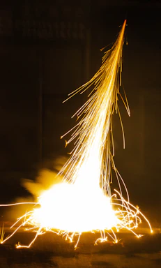 A large fire is lit up in the dark