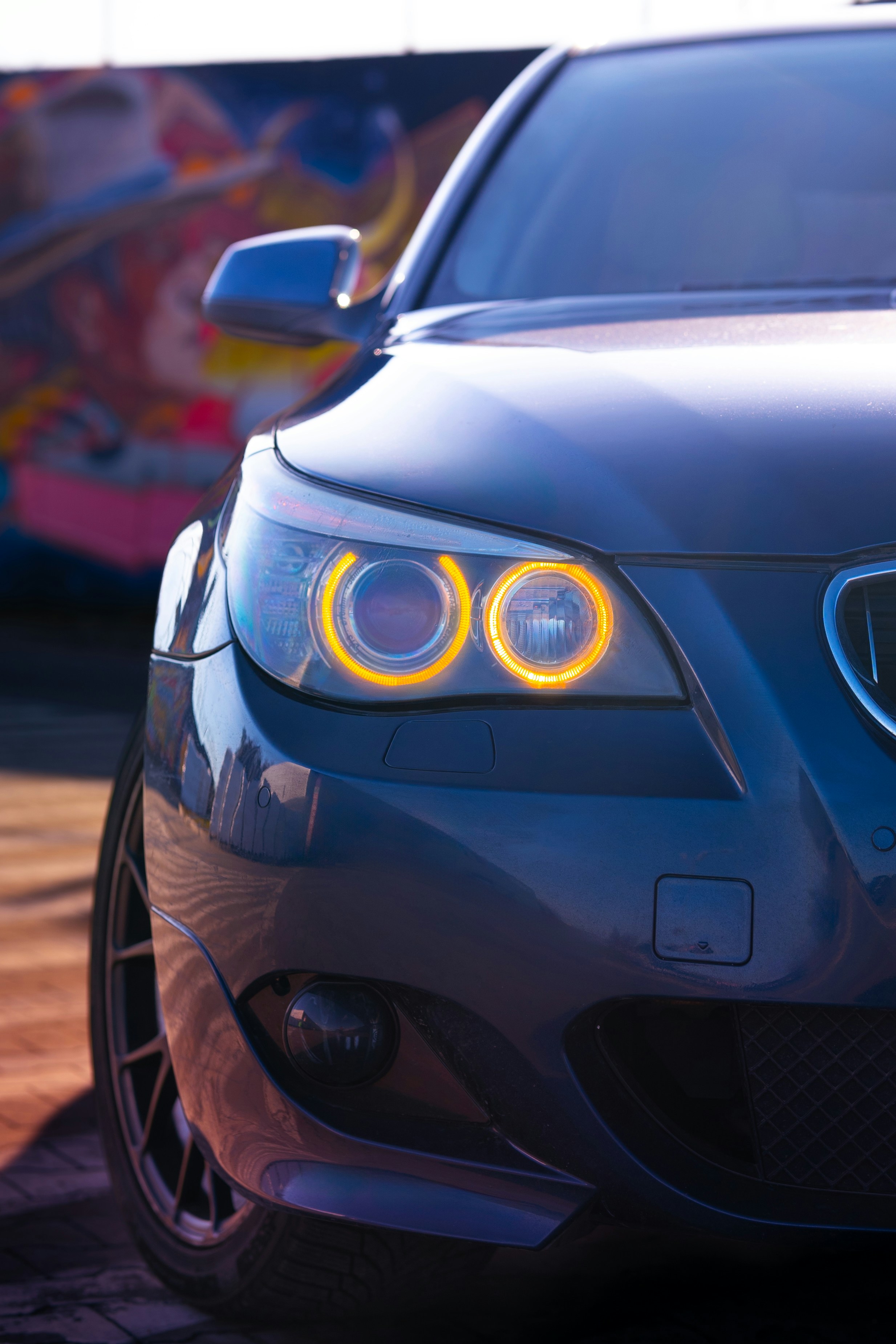 A close up of a car on a city street