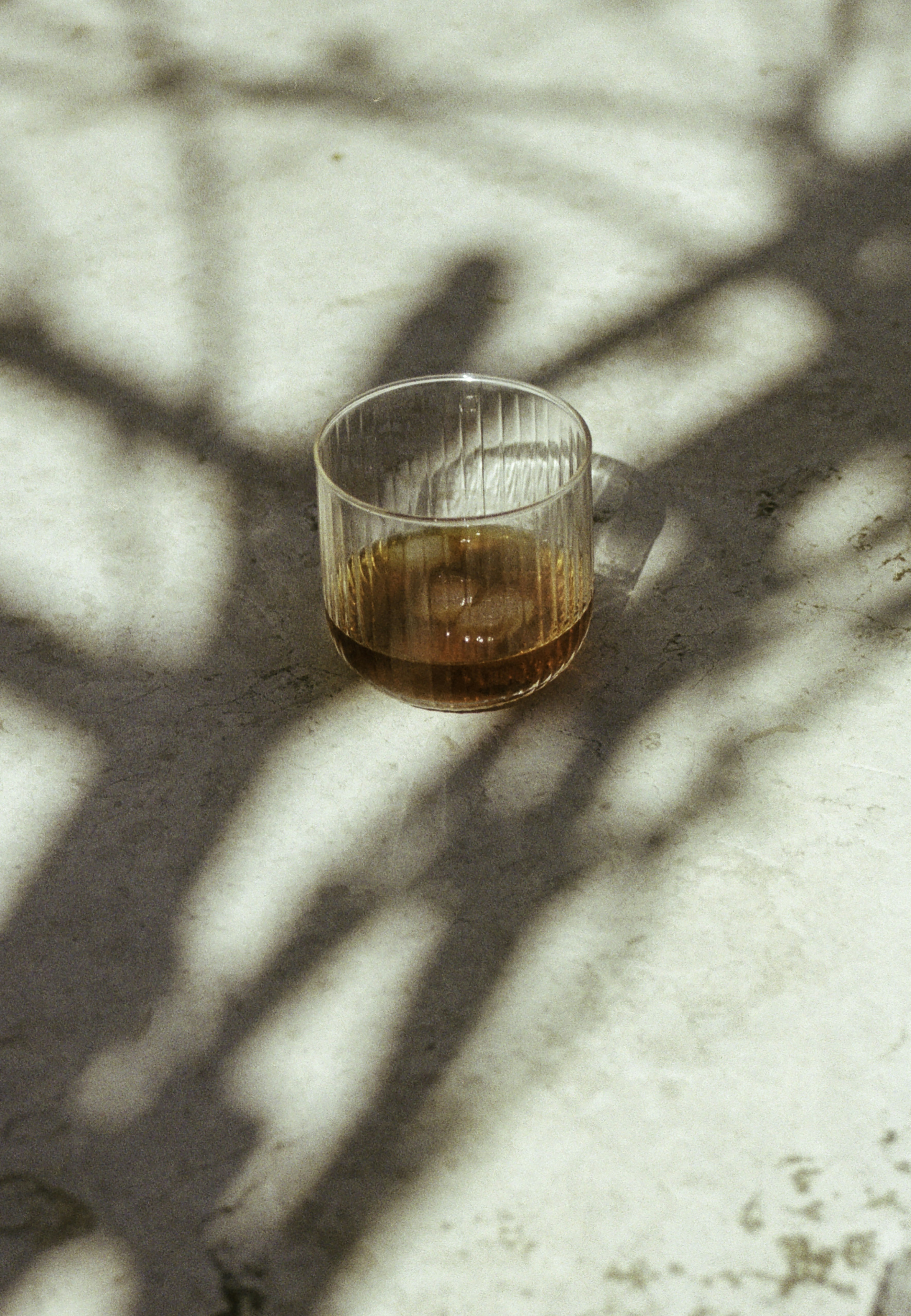 A glass of wine sitting on top of a table