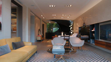 A living room filled with furniture and a flat screen TV
