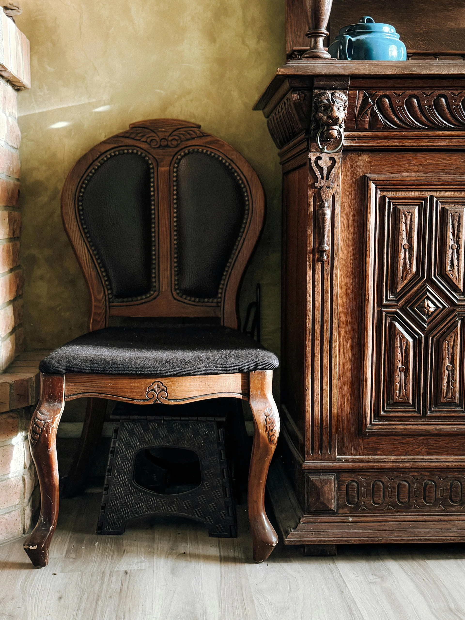 A chair and a cabinet in a room