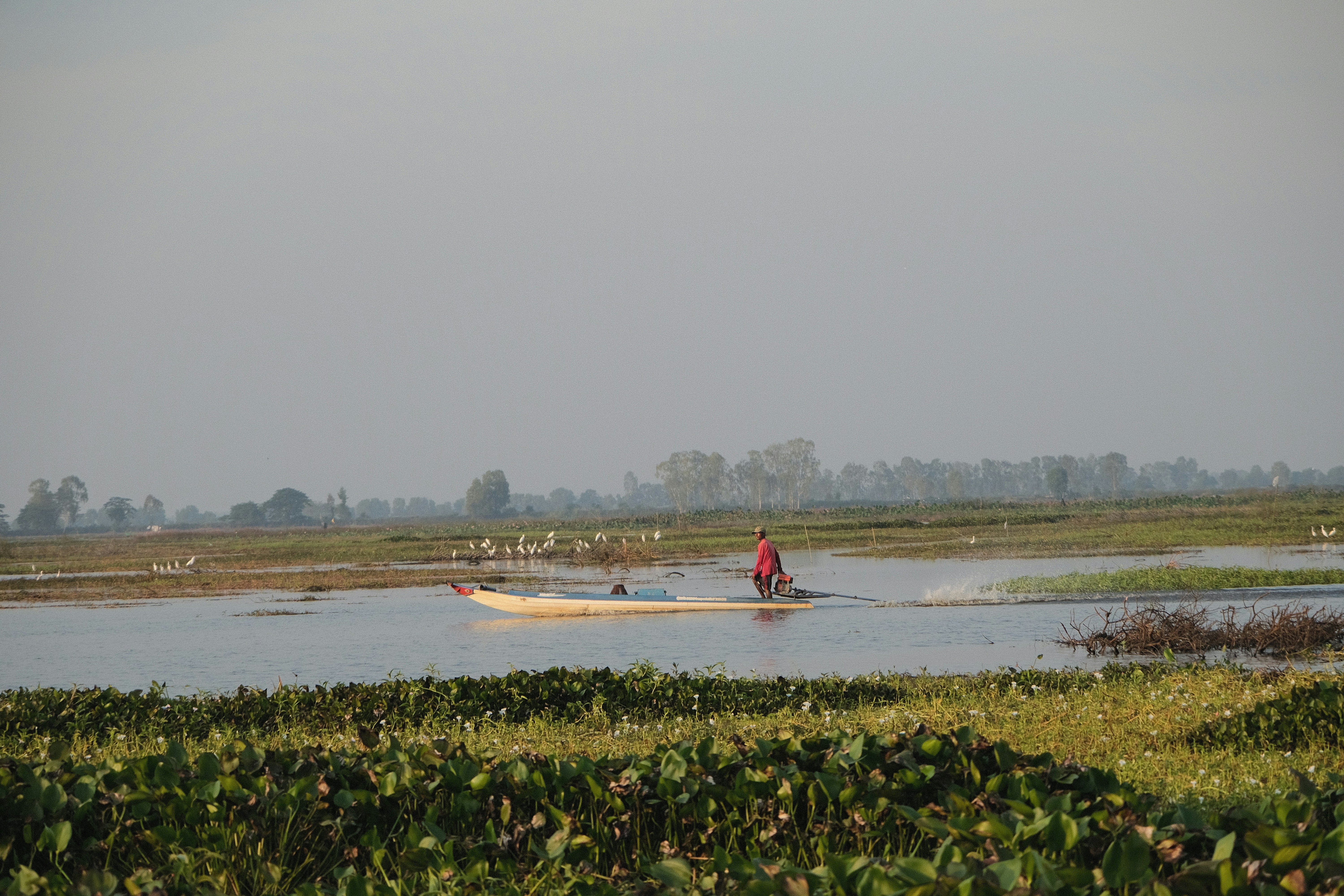 A person in a boat in a body of water