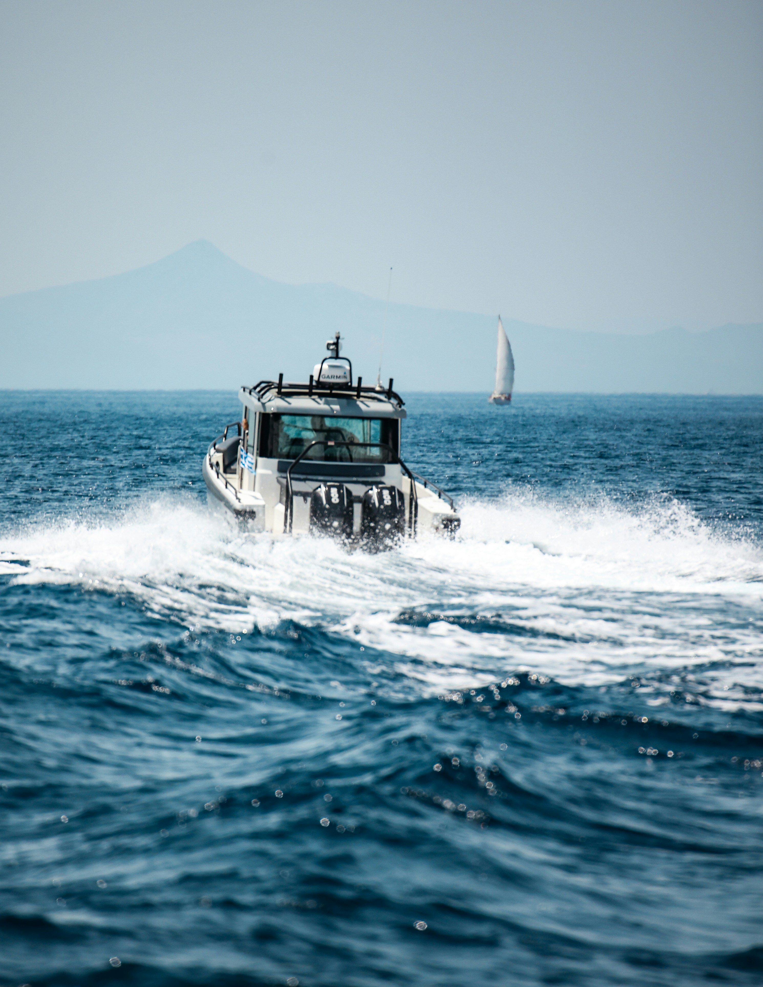 A small boat in the middle of the ocean