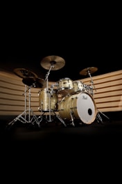 A drum set is shown in the dark
