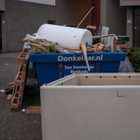 A pile of junk sitting outside of a building