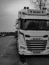 A black and white photo of a truck