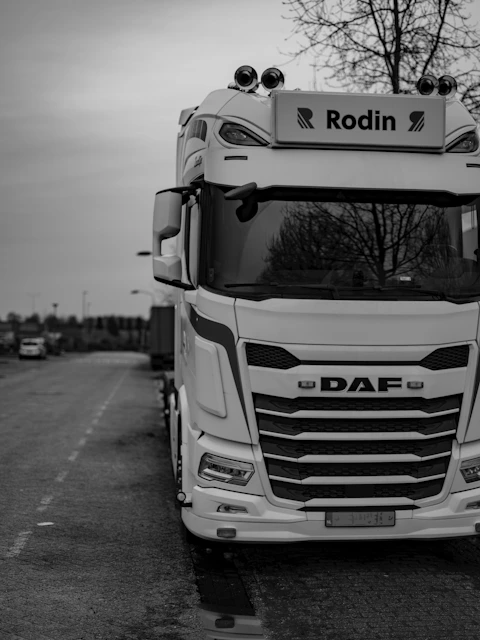 A black and white photo of a truck