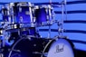A close up of a blue drum set