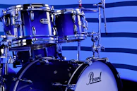 A close up of a blue drum set