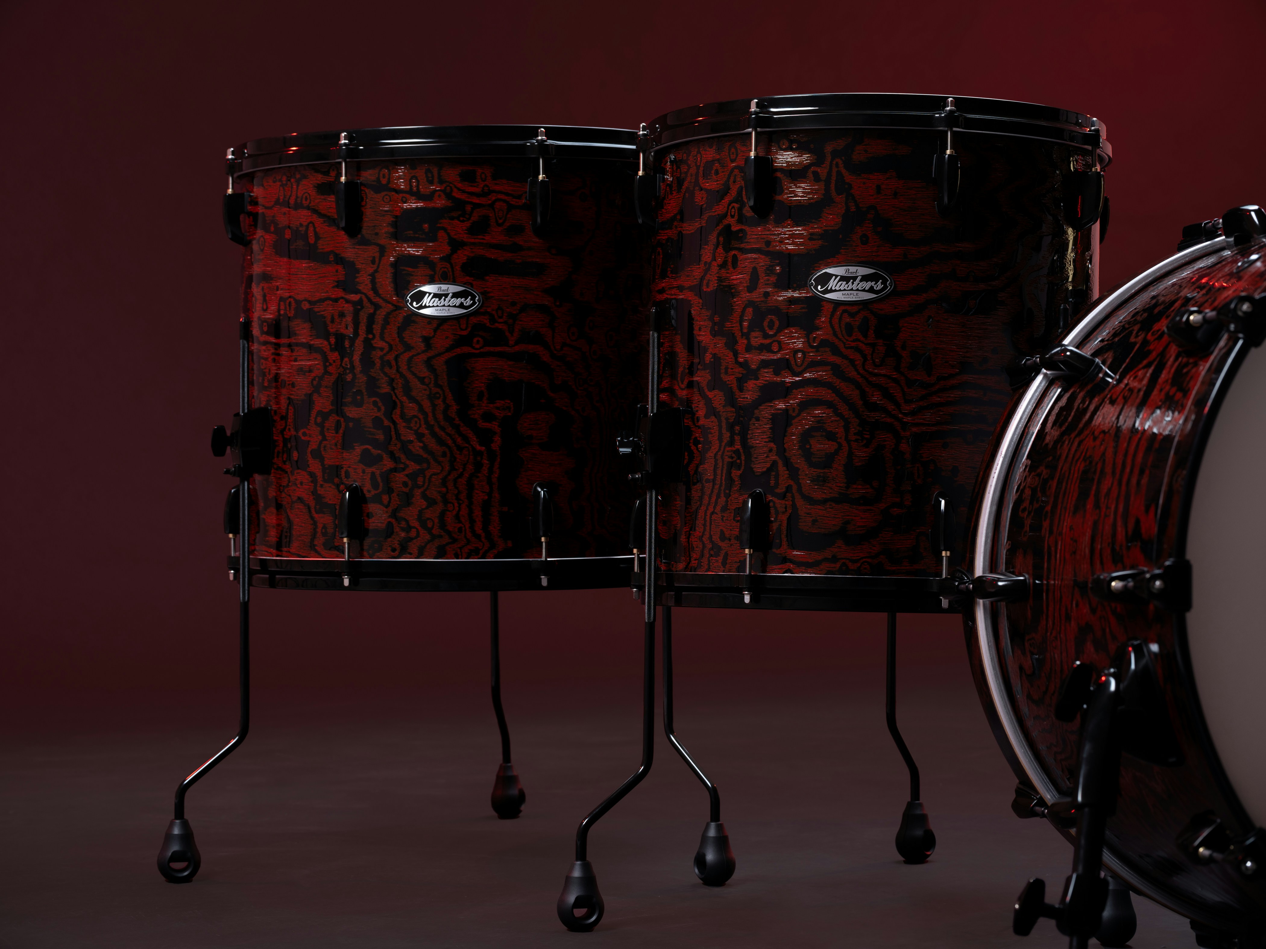 A red and black drum set sitting on top of a table photo – Free Drums ...