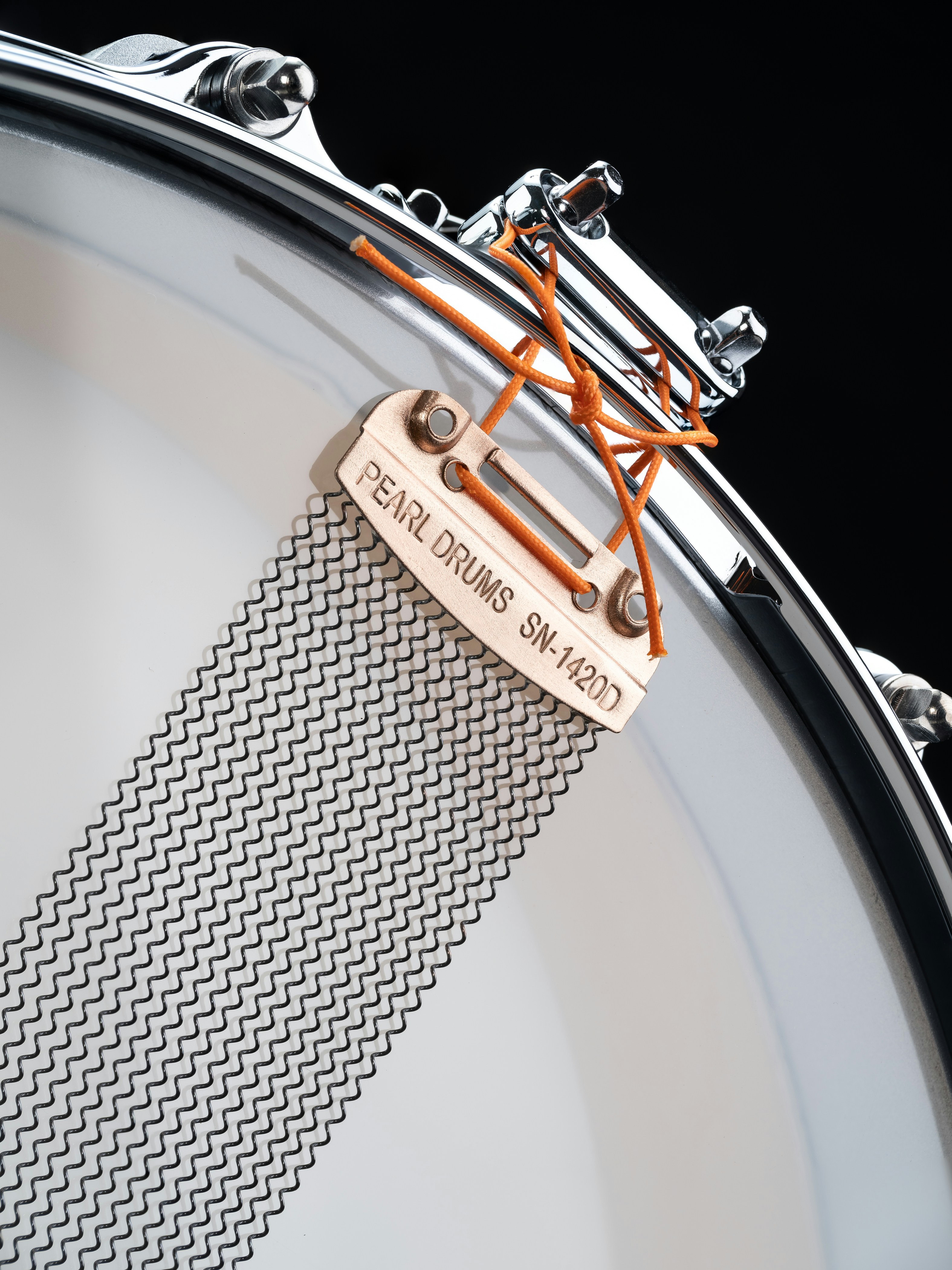 A close up of a drum head with a label on it