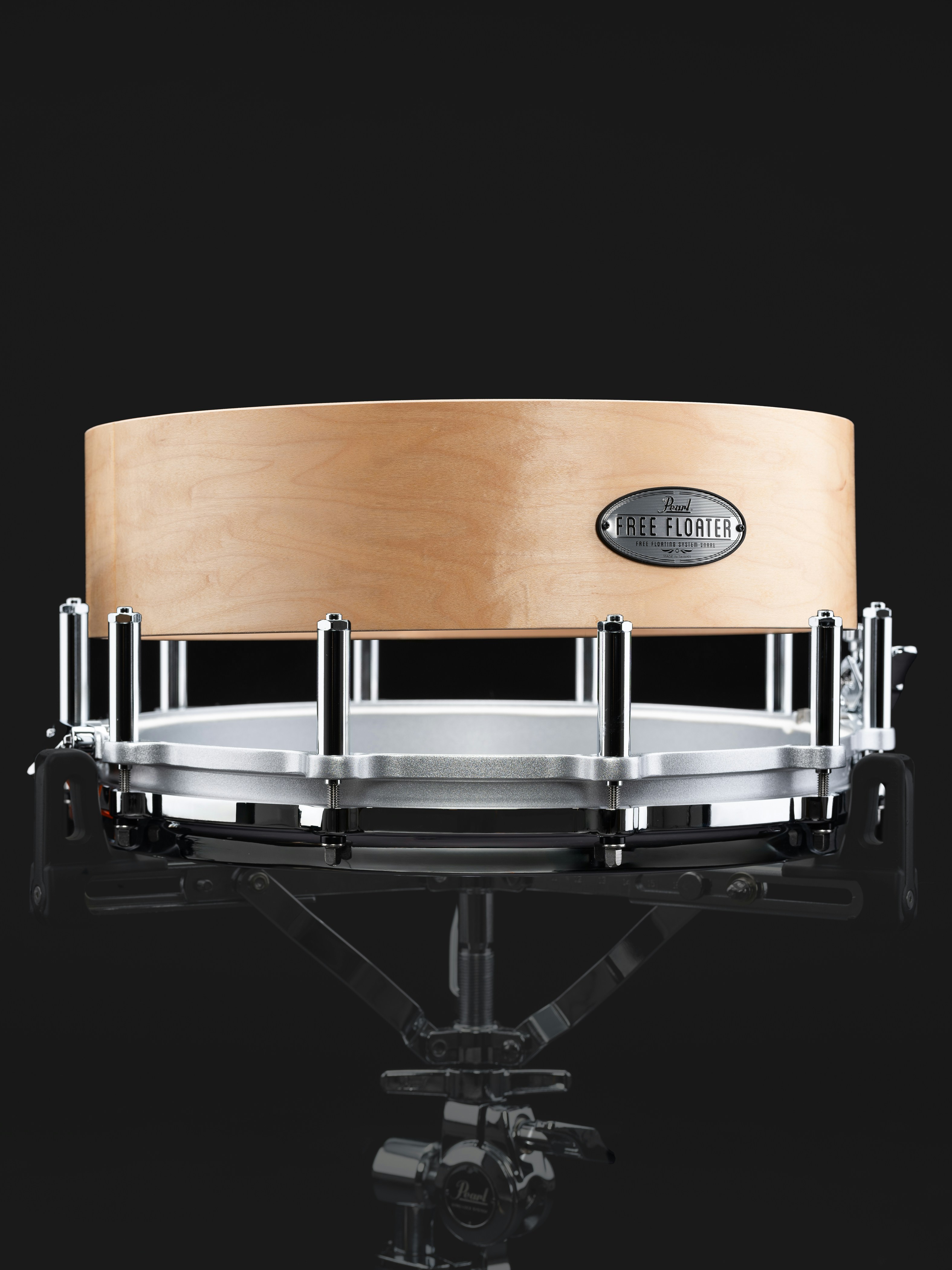 A close up of a drum on a black background