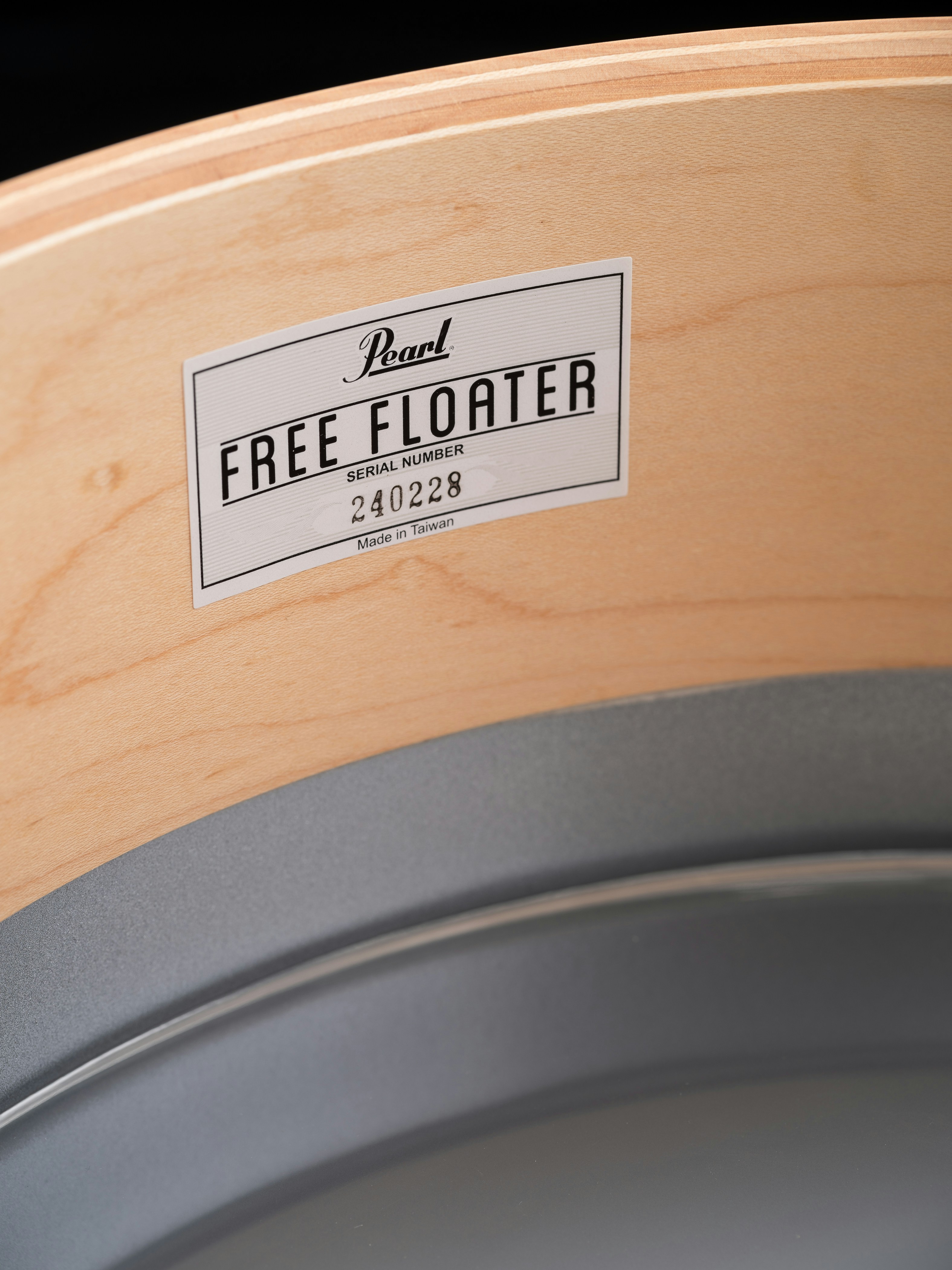A close up of a wooden container with a label on it