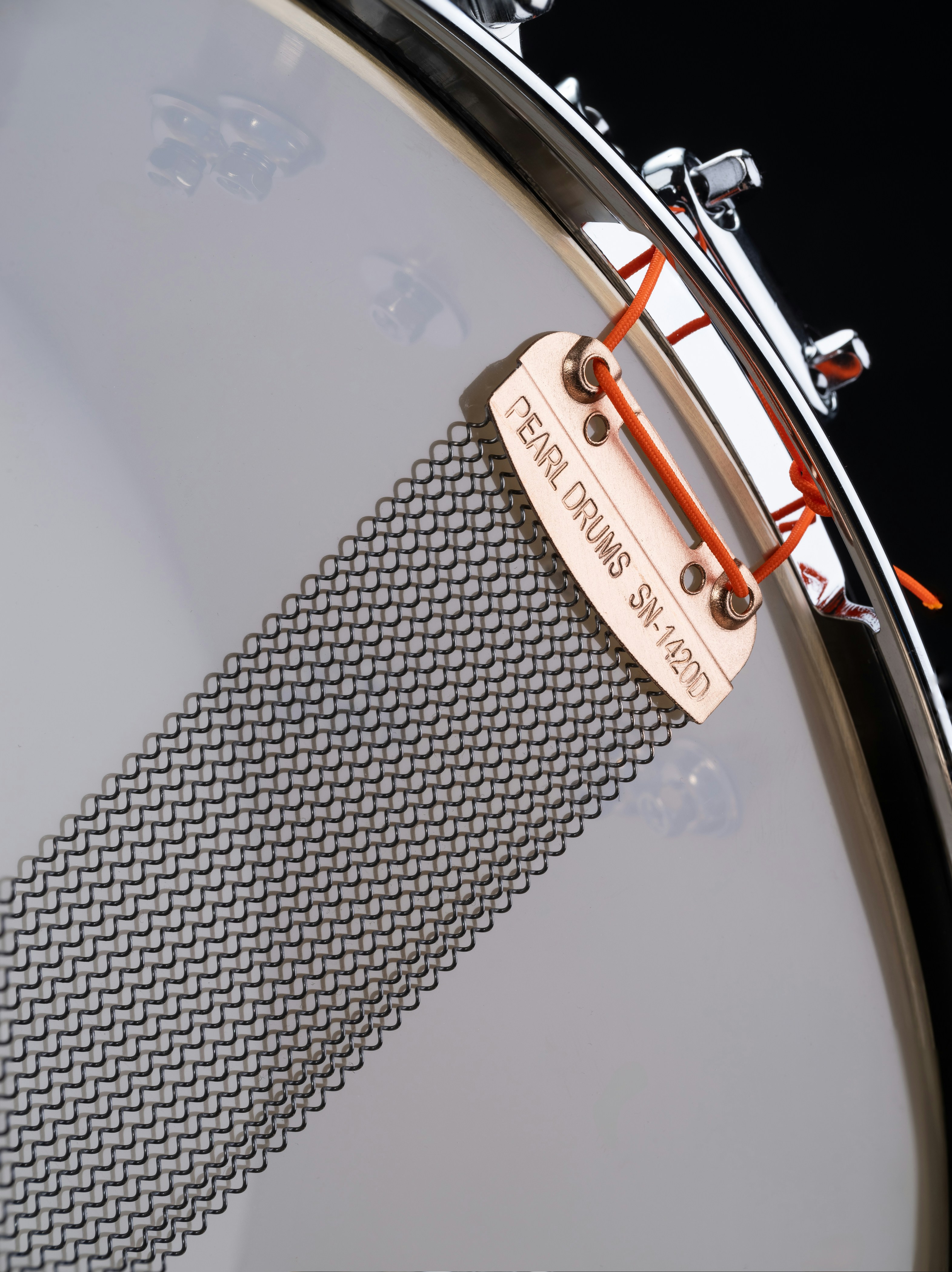 A close up of a drum head with a label on it