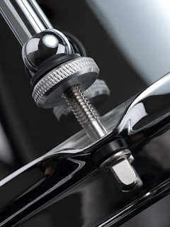 A close up of a black car door handle