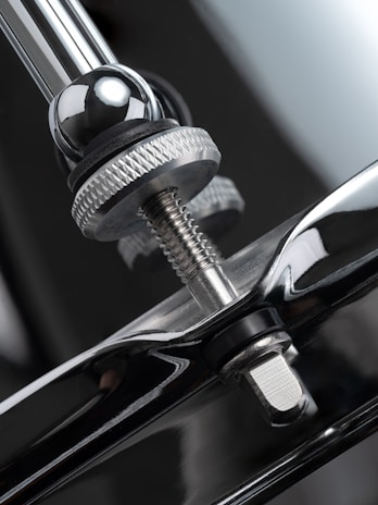 A close up of a black car door handle