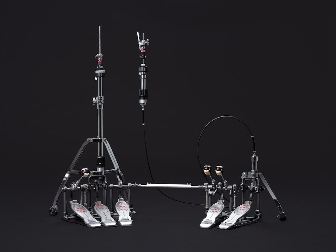 A black and white photo of a tripod, Eliminator Redline Family Pearl Drums Drum Hardware