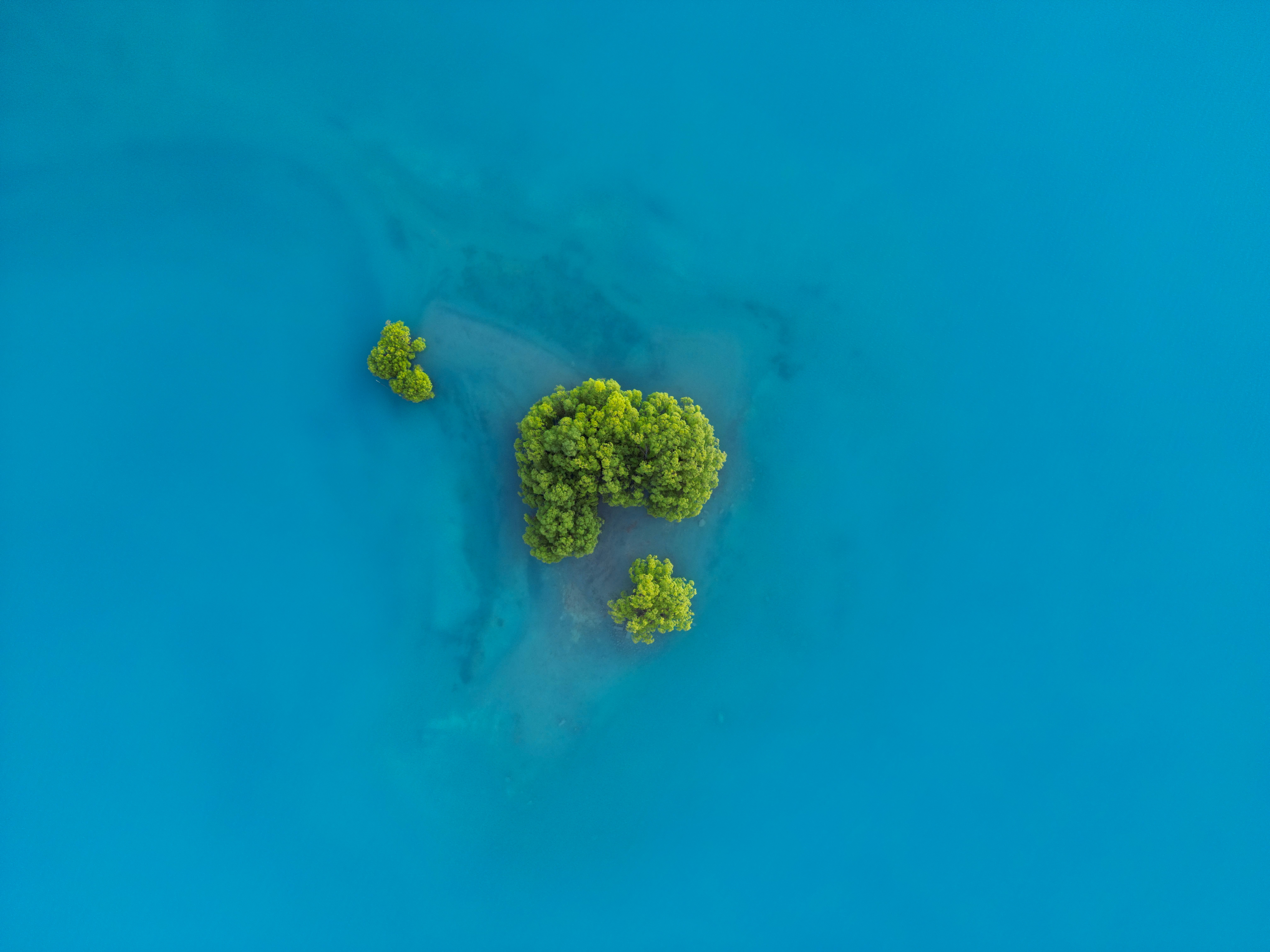 An aerial view of a small island in the middle of a body of water