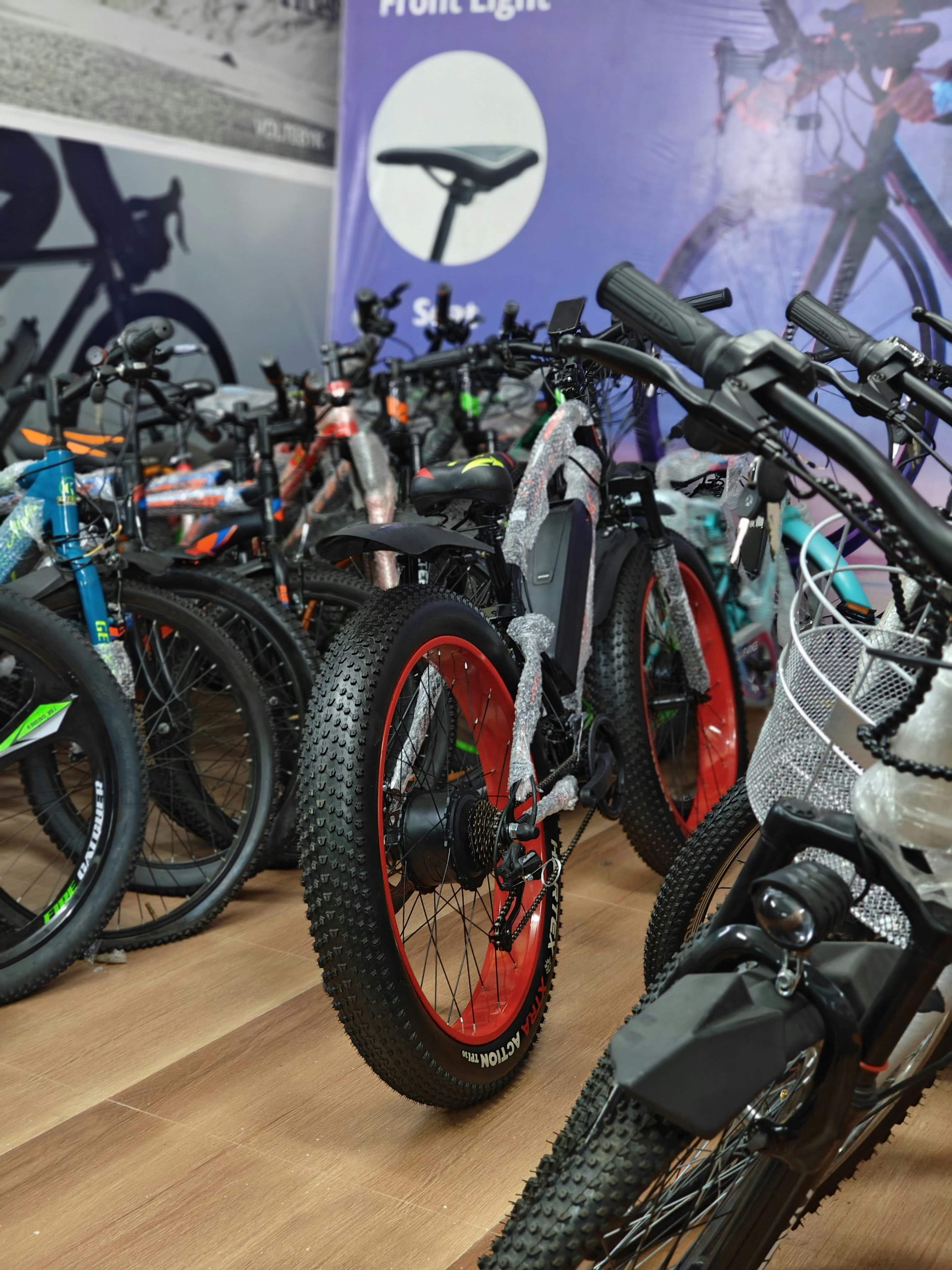 A bunch of bikes that are on a wooden floor
