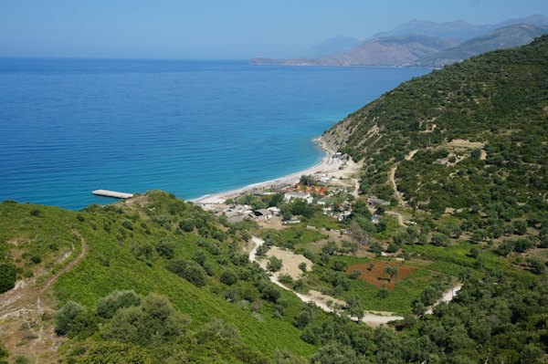 A scenic view of a beach and a body of water — Himarë, Albania