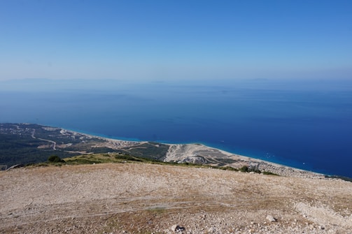 A view of the ocean from the top of a hill