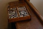 A close up of a wooden shelf with numbers on it
