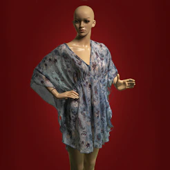 A female mannequin wearing a blue dress and green tights