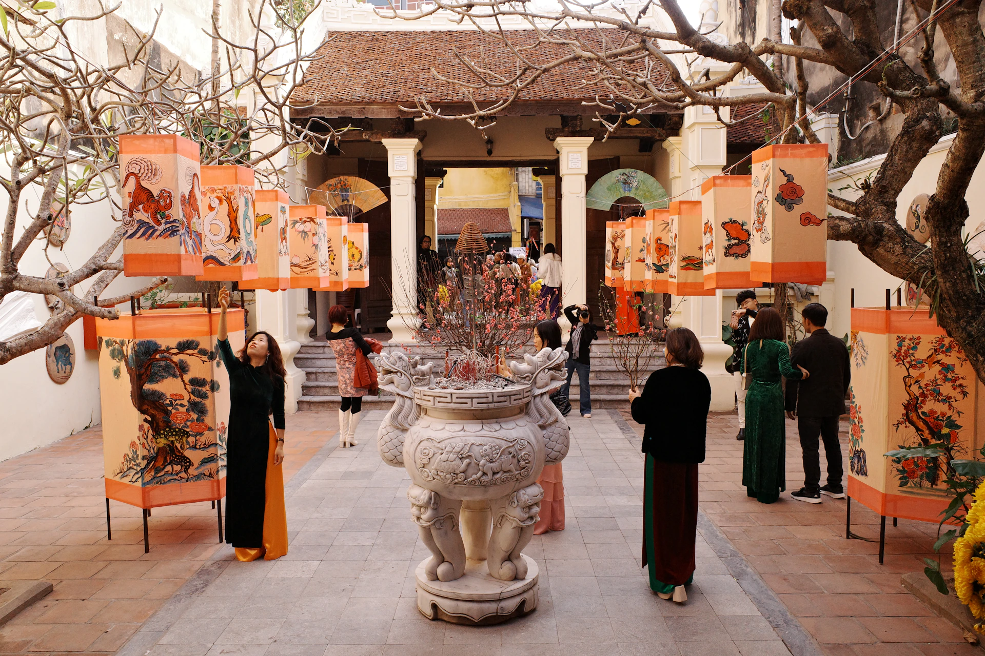 A group of people standing around a fountain