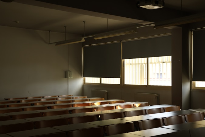 An empty classroom with rows of desks, similar to the campuses Henderson charter applicants are asking to build
