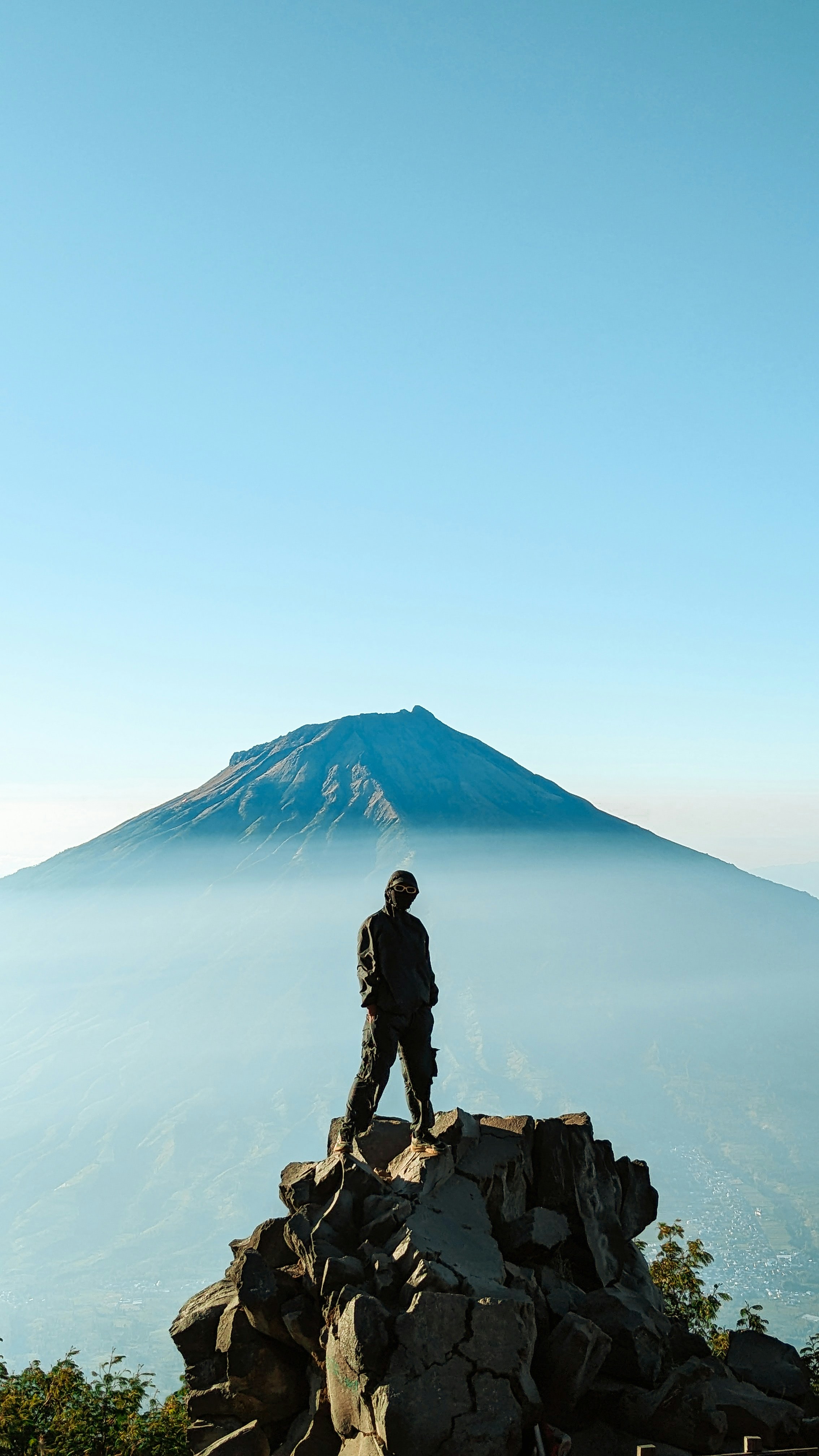A man standing on top of a mountain
