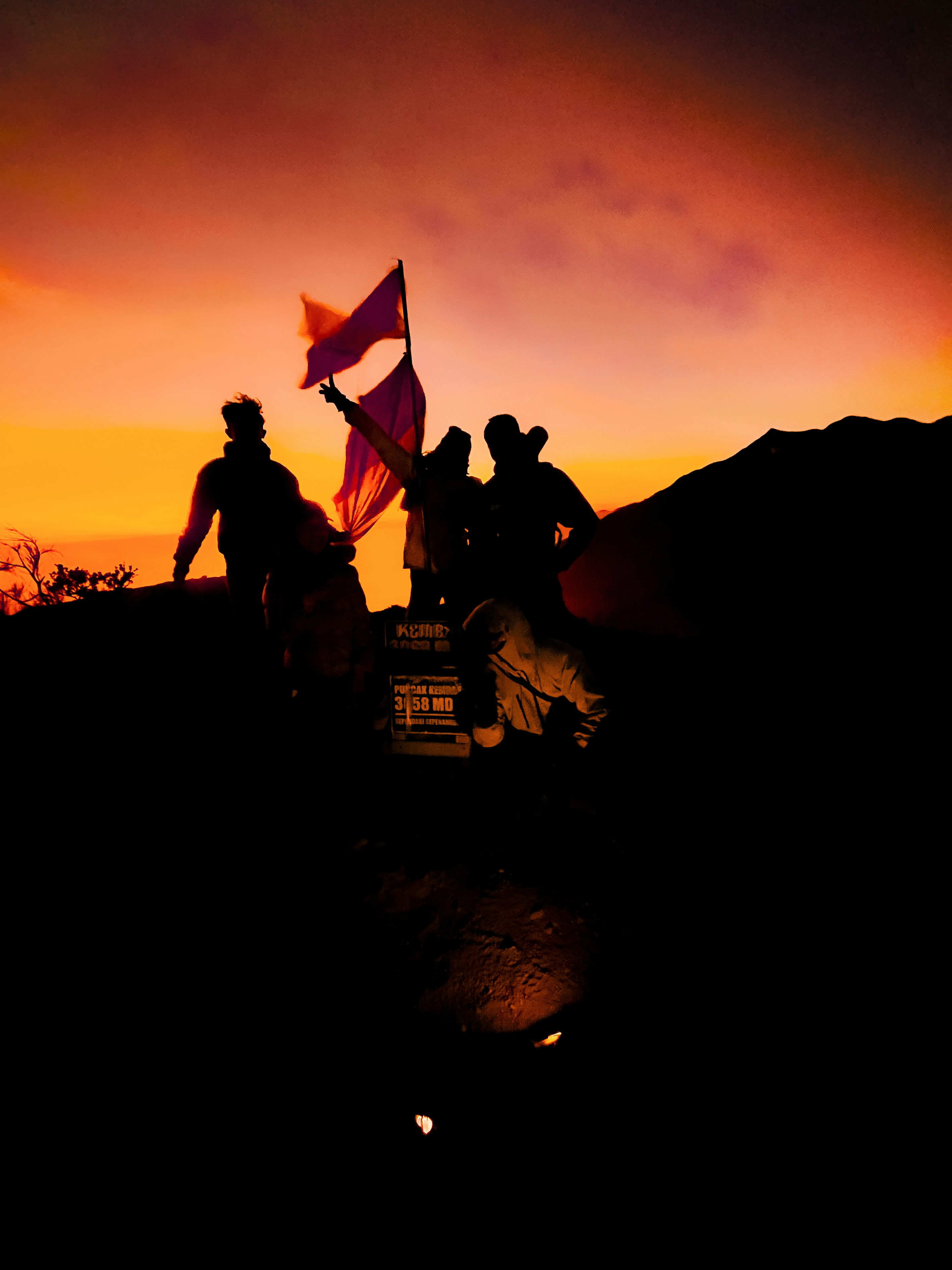 A group of people standing on top of a hill photo – Free Woman Image on ...