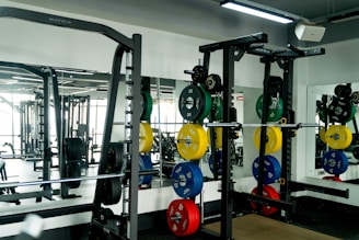 A gym filled with lots of different types of exercise equipment