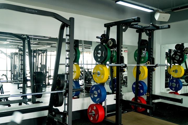 A gym filled with lots of different types of exercise equipment