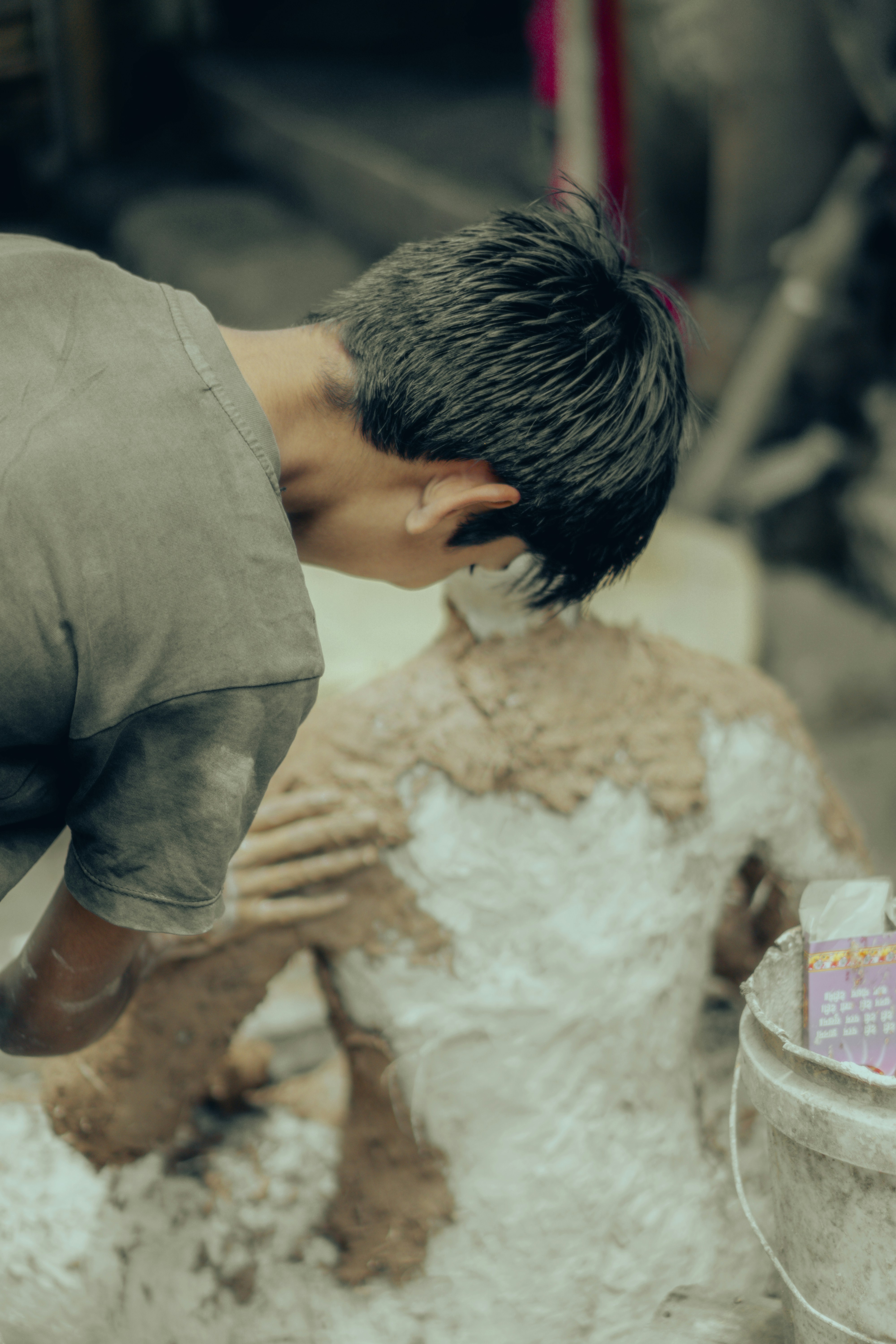 Sculptor shaping a foam clay statue