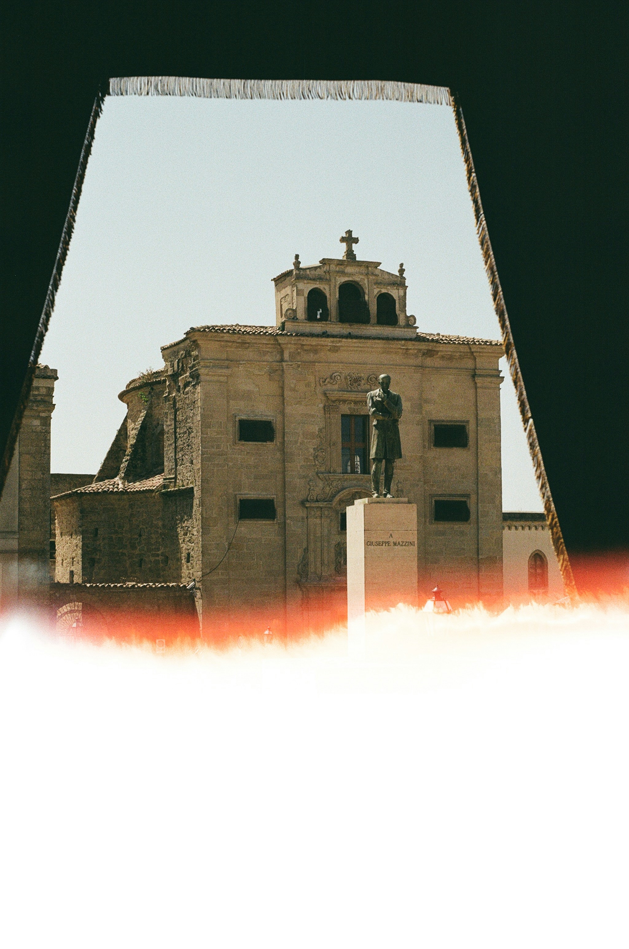 A large building with a clock tower in the middle of it