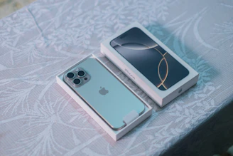 An iPhone in a box sitting on top of a table