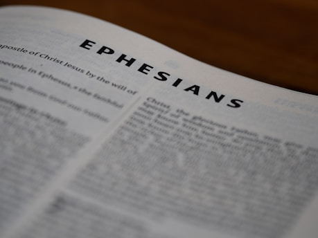 An open bible with the word ephesians printed on it