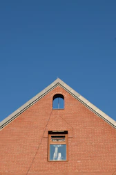 A red brick building with a clock on it