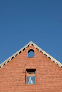 A red brick building with a clock on it