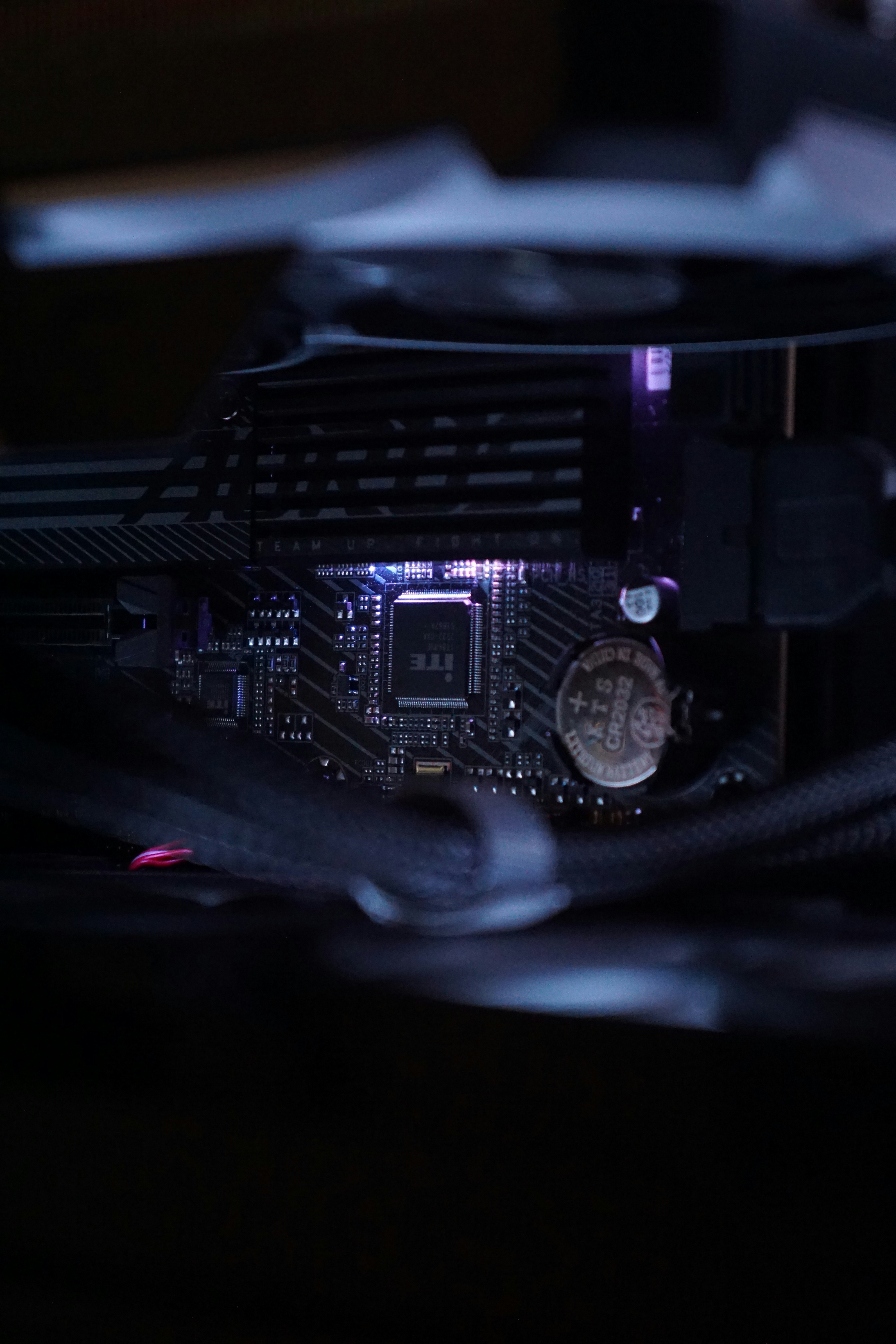 A close up of a computer motherboard with wires