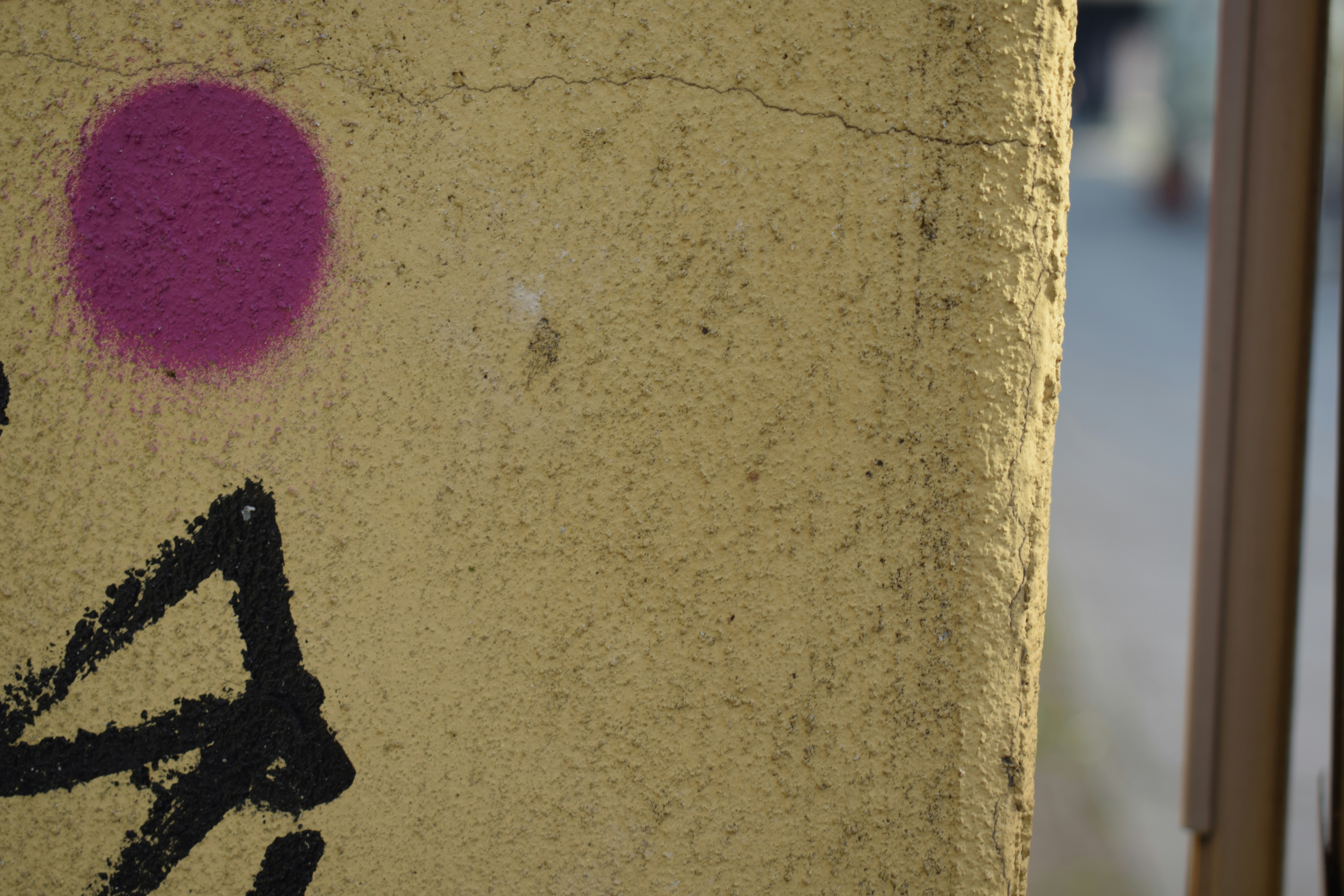 A close up of a graffiti on a wall