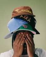 A man covering his face with his hands