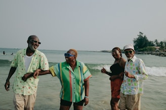 A group of people standing on top of a beach